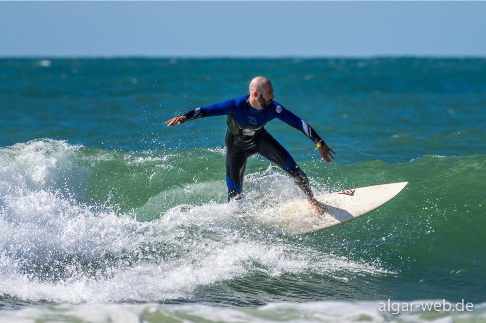 Surfer in Praia da Rocha, Algarve, Portugal